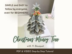 a christmas money tree made out of dollar bills on top of a white box with the words, simple and easy to follow by everyone even for beginners