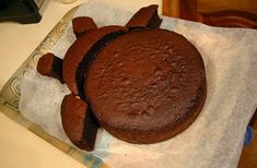 a chocolate cake sitting on top of a piece of paper