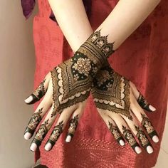 a woman with henna on her hands