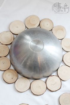 a metal object surrounded by wood slices