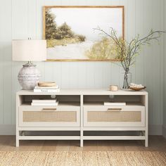 a living room scene with focus on the sideboard and two baskets under the table