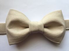 Adorable bow tie, made with 100% cotton. Size 6m-2yo: adjustable elastic  suspenders run from 16"- 25" long, bow tie's neck strap is about 14" long; (adjustable), velcro closureSize 3yo-5yo: adjustable elastic suspenders run from 16"-25" long, bow tie's neck strap is about 15" long; (adjustable), velcro closureSize 6yo-12yo: adjustable elastic suspenders run from 21"-34" long, bow tie's neck strap is about 16 1/2" long; (adjustable), velcro closureSize adult up to 5'6": adjustable elastic suspen Classic White Adjustable Bow Tie, White Dapper Bow Tie For Summer, Adjustable White Bow Tie With Decorative Bow, Classic White Bow For Summer, Classic White Bow With Butterfly Knot, Adjustable White Bow Tie With Butterfly Knot, Dapper White Adjustable Bow Tie, Dapper Adjustable White Bow Tie, Gold Bow Tie