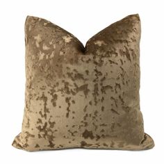 a brown and beige pillow on a white background