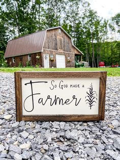 a sign that says so god have a farmer on it in front of a barn