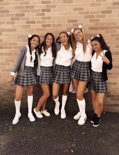 a group of young women standing next to each other