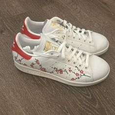 New, In Box, Tags Still Attached And Never Worn. Unique Style With Cherry Blossoms And No Longer Sold In Stores. Adidas Custom High-top Sneakers With Red Sole, White Floral Print Sneakers With Round Toe, Sporty White Sneakers With Floral Print, White Floral Embroidery Low-top Sneakers, White Low-top Sneakers With Floral Embroidery, White Floral Embroidered Low-top Sneakers, White Adidas, Adidas Women, Womens Shoes Sneakers