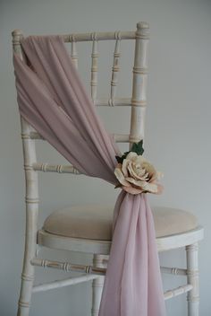 a chair with a flower on the back of it