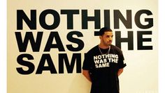 a man standing in front of a wall that says nothing was sam