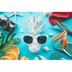 a pineapple wearing sunglasses surrounded by other items on a blue background with starfish