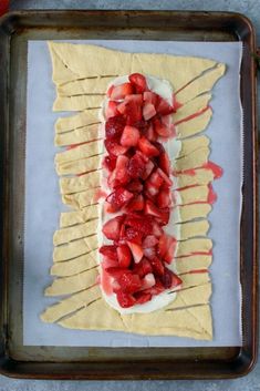 strawberries are arranged on top of the pastry