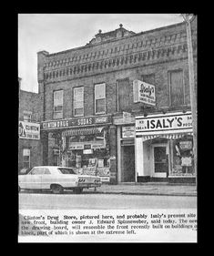 an old black and white photo of a store front