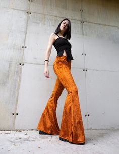 "Velvet bell-bottom pants, inspired by the 70's with high rise. Super stretchy and comfortable. They are long enough to wear with heels and platforms.  Available in two colors, burnt orange, and dark bordeaux.  Perfect for day to day wear, dancing, festivals.... whatever you want These pants are very stretchy, so one size fits two sizes. I recommend choosing your size marked on the size list below.  SIZE XS Bust: 31\"-33\" // 78-83cm Waist: 24\"-25\" //60-65cm Hips: 34\"-35\" // 84-87cm SIZE S B Burnt Orange Hippie Pants, Orange Flare Pants, Orange Flared Pants, Stretch Full-length Hippie Pants, Free People Orange Flare Pants, Velvet Bell Bottoms, Stretchy Pants, Boho Festival, Bell Bottom Pants