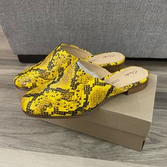 New In Box Retail $110 Heel Height .5 Inches Comfort Features: Cushion Plus Padding, Soft Leather Lining, Durable Resin Rubber Outsole Slip-On Mule Synthetic Upper Yellow Synthetic Mules With Round Toe, Yellow Casual Mules For Spring, Yellow Closed Toe Spring Mules, Yellow Flat Mules For Spring, Yellow Flat Casual Mules, Yellow Leather Closed Toe Mules, Yellow Flat Heel Mules For Spring, Yellow Leather Slip-on Heels, Trendy Yellow Mules For Spring