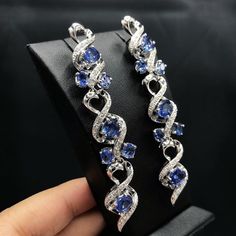 ENJOY OUR WORRY-FREE SERVICE AND THE DAZZLING, GENUINE JEWELRY WE DESIGN AND HANDCRAFT WITH LOVE❤️ ABOUT THE ITEM: IF YOU ARE LOOKING FOR A GORGEOUS AND EXTREMELY LONG, CHANDELIER EARRINGS THAT WILL ABSOLUTELY MAKE EVERYBODY STOP AND STARE! LOOK NO FURTHER! WE ARE PRESENTING YOU A STUNNING PAIR OF CEYLON BLUE SAPPHIRES AND NATURAL DIAMONDS, SET IN LUXURIOUS AND BEAUTIFUL 18K SOLID WHITE GOLD, CHANDELIER EARRINGS! ONE OF A KIND! CUSTOM DESIGNED! Made by our own professional goldsmiths! SUGGESTED Luxury Blue Chandelier Earrings For Formal Occasions, Luxury Tanzanite White Gold Earrings, Luxury White Gold Tanzanite Earrings, Luxury Tanzanite Earrings, Silver Tanzanite Earrings For Wedding, Blue Diamond Bridal Earrings For Formal Occasions, Blue Diamond Bridal Earrings For Formal Events, Blue Cubic Zirconia Diamond Earrings For Wedding, Elegant Hand Set Blue Bridal Earrings