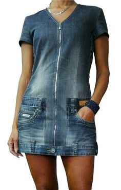 a woman wearing a denim dress with a zipper on the front and pockets at the back