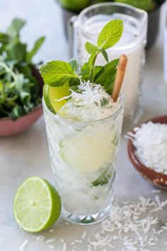 a mojito cocktail with lime and mint garnish