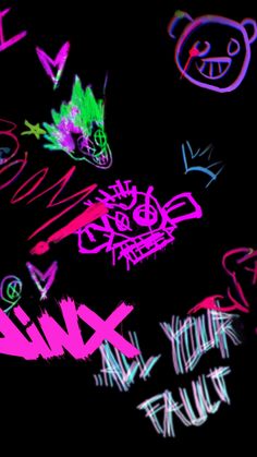 graffiti written on the side of a black wall with pink and green spray painted letters