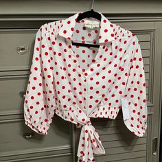 Size Medium- White Blouse With Red Polkadots, Tie Front Closure- Brand New And Never Been Worn Polka Dot V-neck Blouse For Day Out, Red Printed Button-up Top, Cropped Quarter Zip, Long Tee Shirts, Poncho Blouse, Red Floral Print Button-up Blouse, Long Sleeve Polka-dot Blouse With Button Closure, Black Crewneck, Polka Dot Blouse