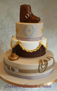 a three tiered cake with boots on top