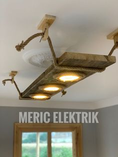 an overhead light fixture in a kitchen with the words meric elektrik above it