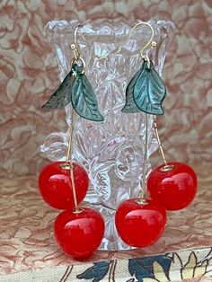 New condition cherry earrings. These drip 3". 2 cherries and leaves per earring. Cherries are about .50" wide. Please see all pictures.  Free shipping Cherry Colored Earrings For Summer Party, Cherry Color Earrings For Summer Party, Cherry Dangle Earrings For Party, Cherry Color Dangle Earrings For Party, Party Cherry Earrings, Retro Red Earrings For Summer, 1950 Dress, Cherry Earrings, Fruit Earrings