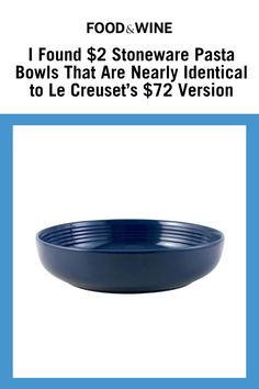 a blue bowl sitting on top of a table next to a white sign that says food & wine i found $ 2 stoneware pasta bowls that are nearly identical to le cruse's $ 7