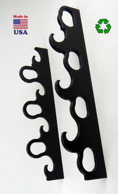 pair of black metal bookends on white background