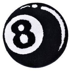 a black and white eight ball rug with the number 8 in it's center