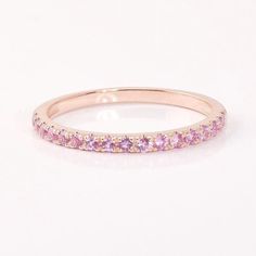 an image of a pink diamond wedding band