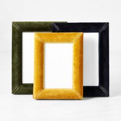 three different colored frames sitting next to each other