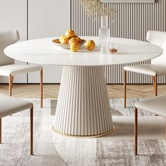 a white table with chairs around it and fruit on the table in front of it