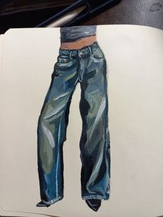 a drawing of a pair of jeans on top of a piece of paper with a pen next to it