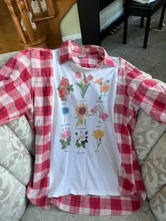 Wear this cute t-shirt top to your next fall outing! The plaid sleeves, collar and back add to the fun of the flower t-shirt on the front. No need to layer and be too warm-this shirt does it all in one! I sewed the t-shirt to the front of a men's plaid long sleeved shirt to give it more flare! Upcycled Clothes, Handmade Shirts, Plaid Sleeve, Long Sleeved Shirt, Mens Plaid, Cute Tshirts, Upcycle Clothes, Shirt Top, Shirts & Tops