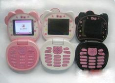 four hello kitty cell phones sitting on top of each other in different colors and designs