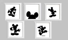 four black and white mickey mouse silhouettes on a gray wall with three framed ones