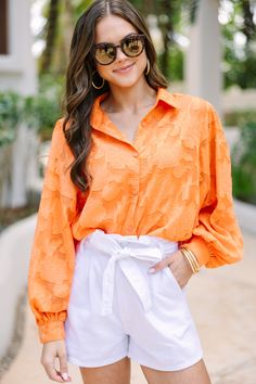 This timeless orange blouse is anything but ordinary. With a unique textured floral print and classic fit, you can truly stand out from the crowd. Long bubble sleeves give it an extra touch of sophistication. Elevate your wardrobe with a blouse that has all the details. Collared neckline Button down front closure Long bubble sleeves Textured fabric Tank lining No stretch Sydney is wearing the small. Textured Blouse, Orange Texture, Blouse Summer, Cute Spring Outfits, Orange Blouse, Mint Julep Boutique, Business Shirts, Casual Work Outfits, Model Fits