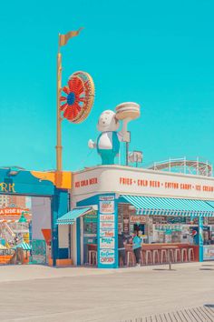 an amusement park with a ferris wheel and other rides