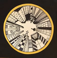 a black and yellow clock with buildings in the middle on it's face is shown