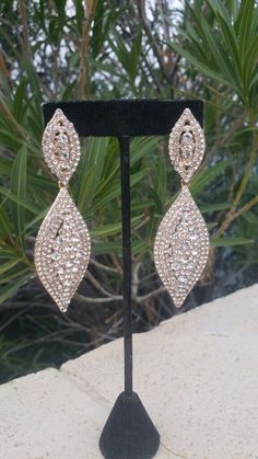 Glamorous Crystal Clip-on Earrings For Formal Events, Glamorous Rhinestone Clip-on Earrings For Formal Events, Glamorous Rhinestone Earrings For Glamorous Events, Glamorous Clip-on Earrings For Evening, Glamorous Evening Clip-on Earrings, Glamorous Formal Chandelier Earrings With Bling, Glamorous Sparkling Diamond Earrings, Glamorous Formal Chandelier Earrings With Crystals, Glamorous Formal Diamond Earrings