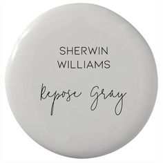 a white button with writing on it that says, shewin williams reposs gray