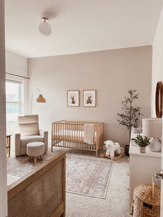 a living room filled with furniture and a baby crib