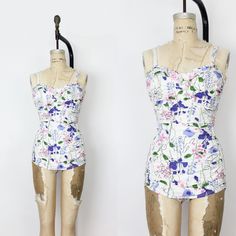 Vintage 1940s  Jantzen floral cotton swimsuit in white with purple, pink and green flowers.  Curve hugging fit thanks to elastic shirring down the front and along the entire back side.  Top ruffled front edge with a lightly boned front bust.  Low rise front with an overlay atop elastic leg holes.  All cotton with a cotton lined bust and metal zipper up the back. Measurements of mannequin for reference are a 36" bust, 27" waist and 35" hips.  Would best fit an Small  ♦ MEASUREMENTS ♦ Bust - 30" t Retro Fitted Swimwear For Spring, Retro Fitted Floral Print Swimwear, Lined Fitted Swimwear For Spring, Retro Fitted Lined Swimwear, Vintage Fitted Floral Print Swimwear, Fitted Vintage Floral Print Swimwear, 1940s Swimsuit, Elastic Shirring, Suit Purple