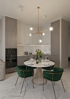 a dining table with four chairs and a vase on it in the middle of a kitchen