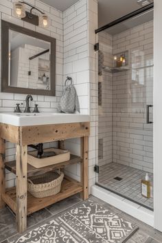 a bathroom with a sink, mirror and shower stall in the corner is decorated with white tiles