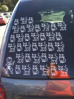 an image of a car that has been decorated with cats on the back and side