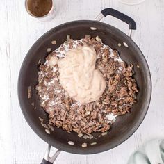 a pan filled with food on top of a white table