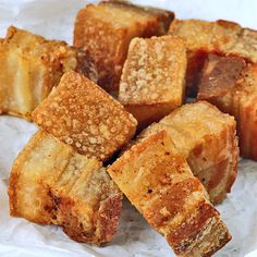 several pieces of bread sitting on top of wax paper