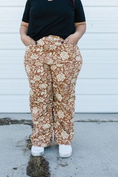 ALL SALES FINAL NOT ELIGIBLE FOR RETURN Step into style with the Keely Pant! These brown, floral-printed beauties are made from lightweight denim for all-day comfort. Featuring functioning buttons, pockets, and a zipper, plus sizes also have an elastic waistline. With a chic straight leg, these pants are a must-have for any wardrobe. The brand of these jeans are Polagram. Model is wearing a small and is 5'5". Shown wearing the Seely Sweater. Plus model is wearing a 1X and is 5'2". Shown wearing Plus Model, Sweater Plus, Brown Floral, Floral Printed, Straight Leg, Floral Prints, Plus Size, Zipper, Wardrobe