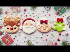 three decorated cookies sitting on top of a table