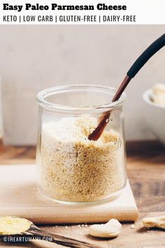 a jar filled with homemade parmesan cheese on top of a wooden cutting board